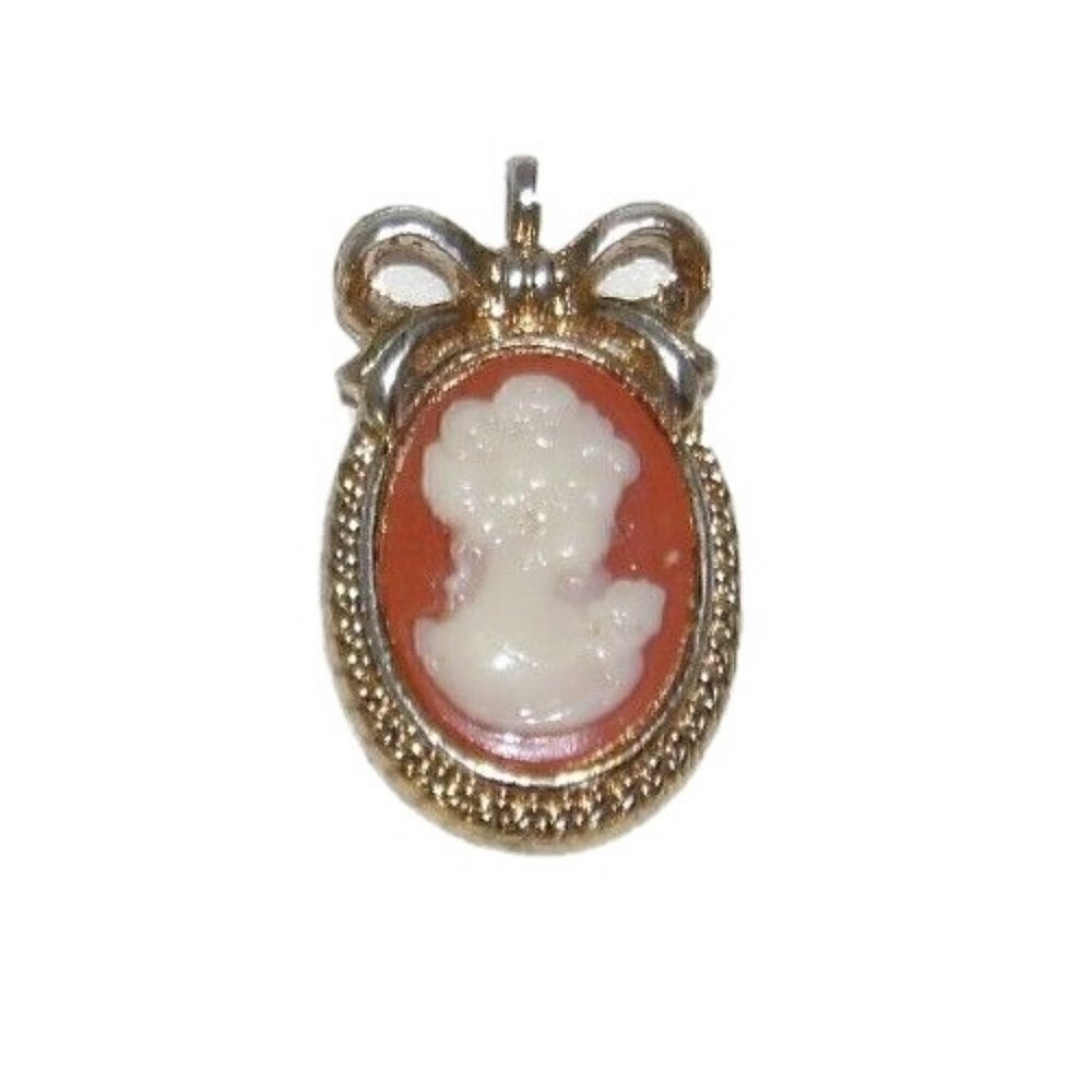 Vintage cameo pendant approx 1/2 X 3/4" with worn, discolored gold tone setting